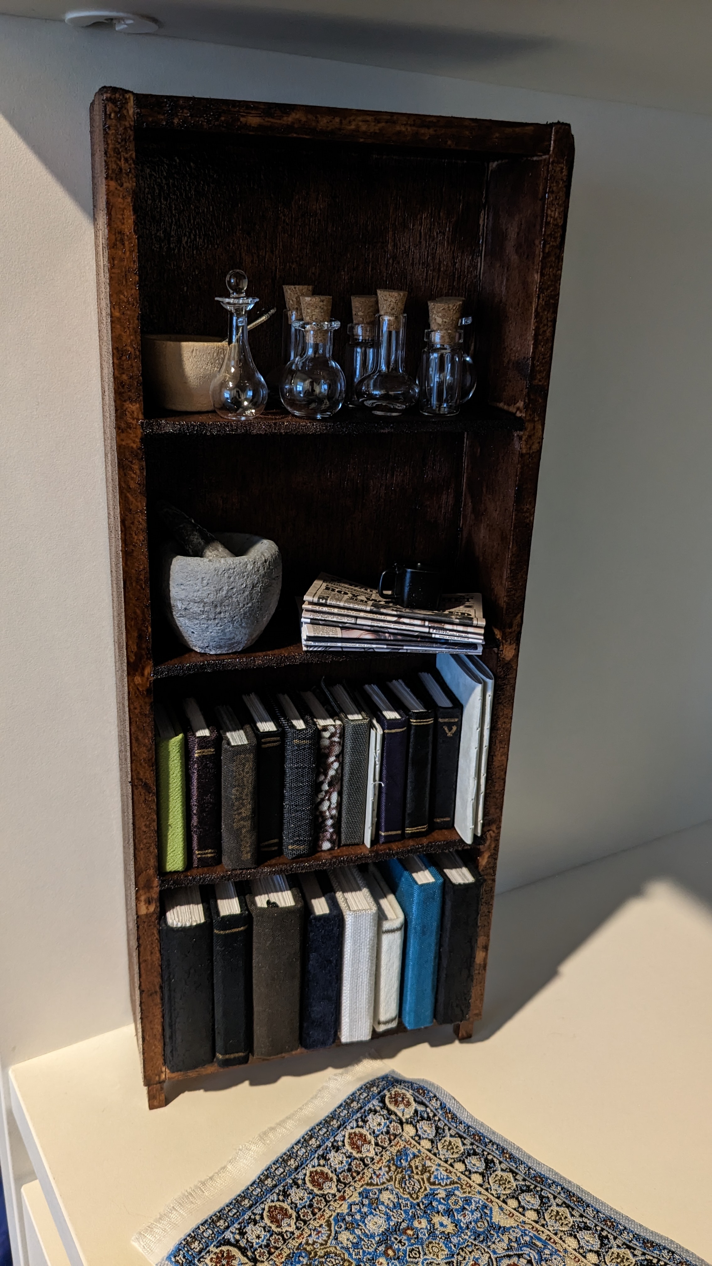 Completed shelf with books and such